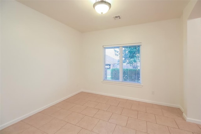10928 NW 38th Ter, Yukon, OK 73099 - unfurnished room with light tile patterned floors
