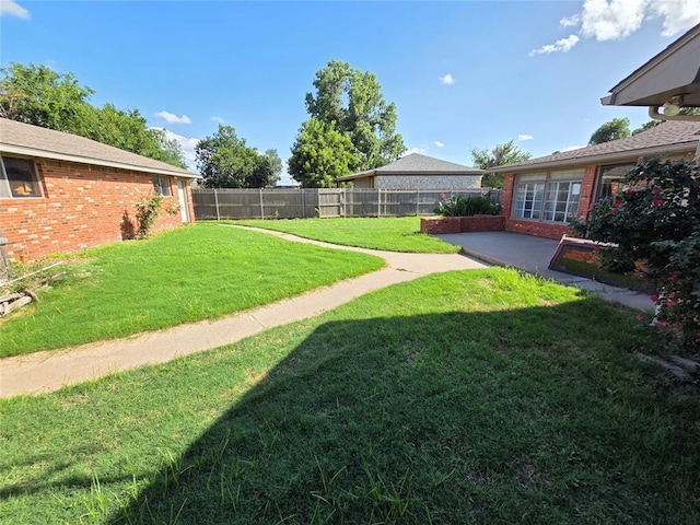 1103 S Hadden Ave, El Reno, OK 73036 - fenced backyard featuring a patio