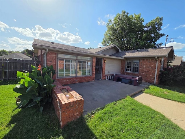 1103 S Hadden Ave, El Reno, OK 73036 - back of property featuring brick siding and a patio