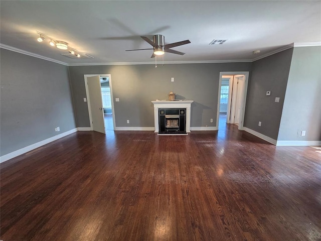 1103 S Hadden Ave, El Reno, OK 73036 - unfurnished living room with a fireplace, dark wood finished floors, ceiling fan, and ornamental molding