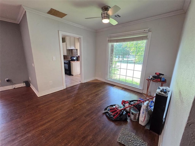 1103 S Hadden Ave, El Reno, OK 73036 - unfurnished room with wood finished floors, ornamental molding, and a ceiling fan