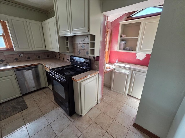 1103 S Hadden Ave, El Reno, OK 73036 - kitchen with tile counters, black electric range oven, open shelves, stainless steel dishwasher, and ornamental molding