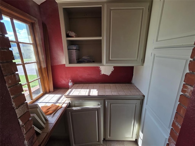 1103 S Hadden Ave, El Reno, OK 73036 - kitchen with tile counters and open shelves
