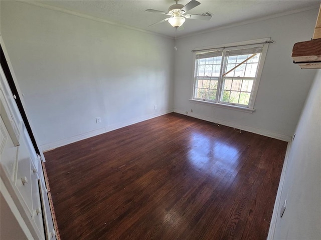 1103 S Hadden Ave, El Reno, OK 73036 - empty room featuring dark wood finished floors, ceiling fan, and ornamental molding