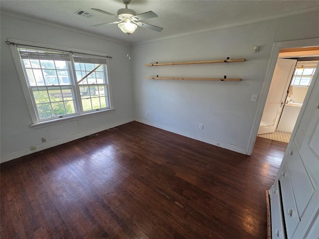 1103 S Hadden Ave, El Reno, OK 73036 - spare room featuring wood finished floors, healthy amount of natural light, ceiling fan, and crown molding