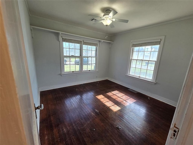 1103 S Hadden Ave, El Reno, OK 73036 - empty room with healthy amount of natural light, hardwood / wood-style floors, a ceiling fan, and crown molding