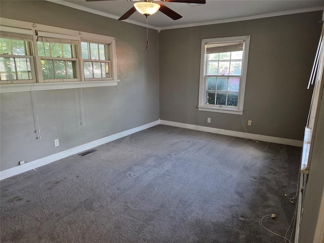 1103 S Hadden Ave, El Reno, OK 73036 - empty room featuring crown molding, ceiling fan, plenty of natural light, and carpet flooring
