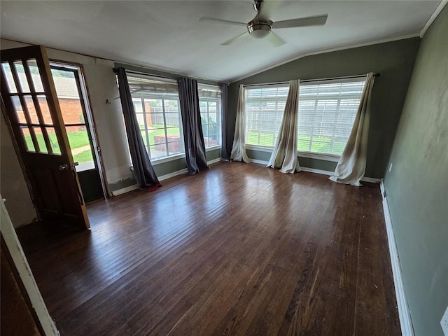 1103 S Hadden Ave, El Reno, OK 73036 - empty room featuring vaulted ceiling, a ceiling fan, dark wood-style flooring, and plenty of natural light
