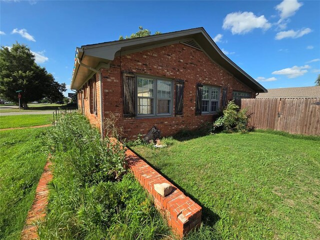 1103 S Hadden Ave, El Reno, OK 73036 - view of property exterior with brick siding