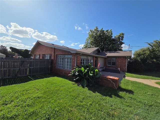 1103 S Hadden Ave, El Reno, OK 73036 - rear view of house with brick siding