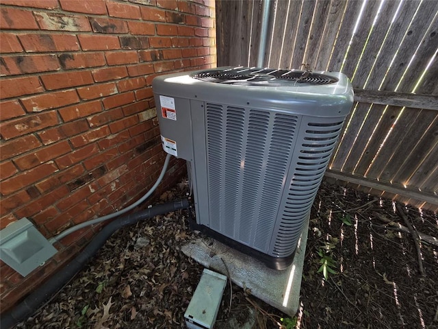 1103 S Hadden Ave, El Reno, OK 73036 - exterior view of a cooling unit and brick siding