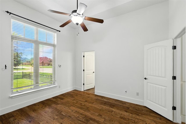 15016 Kurdson Way, Edmond, OK 73013 - unfurnished bedroom with wood finished floors and a ceiling fan