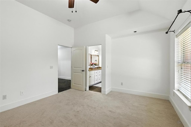 15016 Kurdson Way, Edmond, OK 73013 - unfurnished bedroom with carpet, lofted ceiling, ensuite bath, and a ceiling fan
