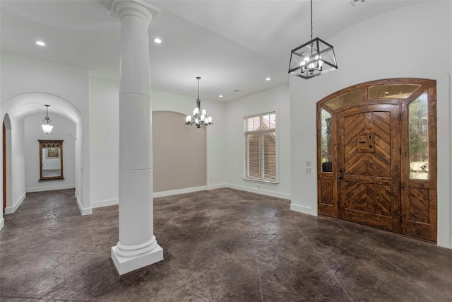 15016 Kurdson Way, Edmond, OK 73013 - entryway featuring a chandelier, concrete flooring, recessed lighting, and arched walkways