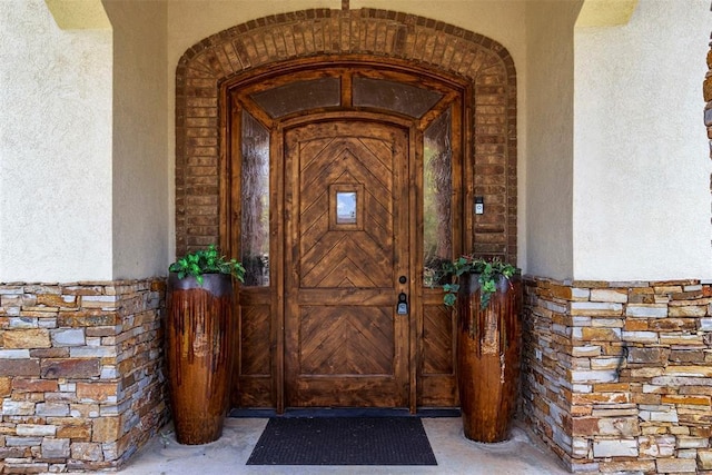 15016 Kurdson Way, Edmond, OK 73013 - entrance to property featuring stucco siding and stone siding