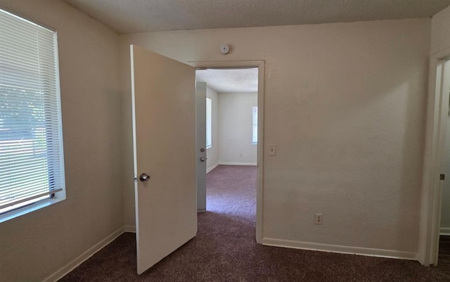 1325 SW 28th St, Oklahoma City, OK 73108 - spare room with dark colored carpet and a smoke detector