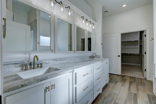13337 SE 95th St, Oklahoma City, OK 73165 - bathroom with double vanity, recessed lighting, and wood finished floors