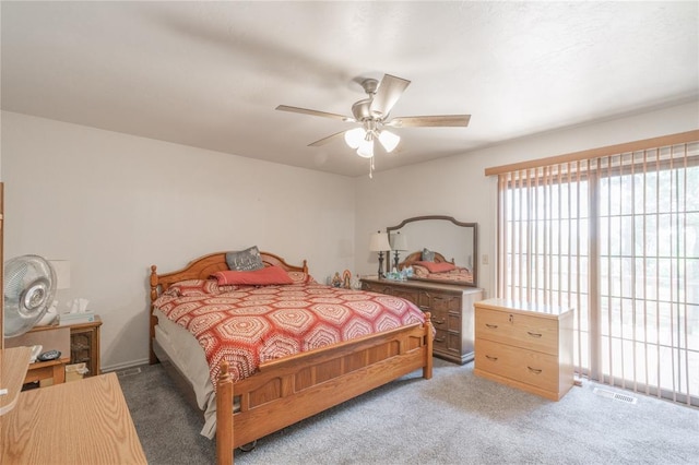 1404 Oak Dr, Edmond, OK 73034 - bedroom featuring light colored carpet and a ceiling fan