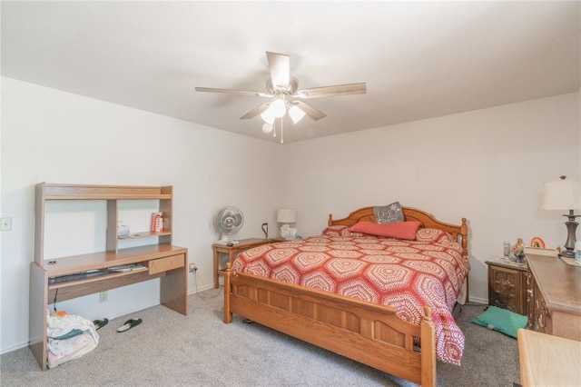 1404 Oak Dr, Edmond, OK 73034 - carpeted bedroom with baseboards and a ceiling fan