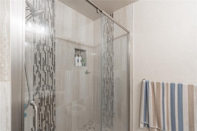 1404 Oak Dr, Edmond, OK 73034 - full bath with a shower stall and a textured wall