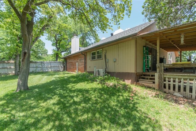 1404 Oak Dr, Edmond, OK 73034 - rear view of property featuring a chimney