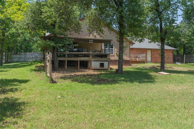1404 Oak Dr, Edmond, OK 73034 - back of property with a wooden deck