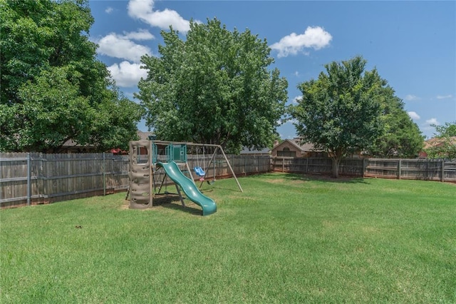 201 NW 160th Ter, Edmond, OK 73013 - fenced backyard with a playground