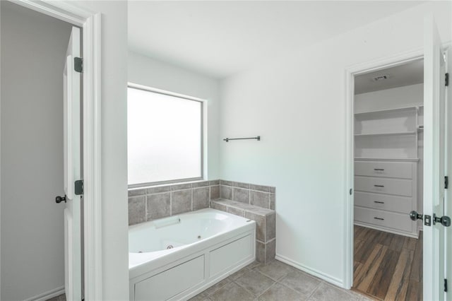 201 NW 160th Ter, Edmond, OK 73013 - full bath with a tub with jets and baseboards
