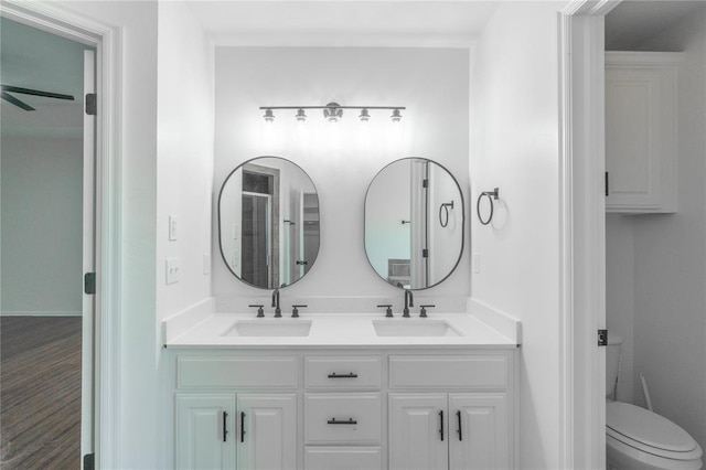 201 NW 160th Ter, Edmond, OK 73013 - bathroom featuring double vanity and toilet