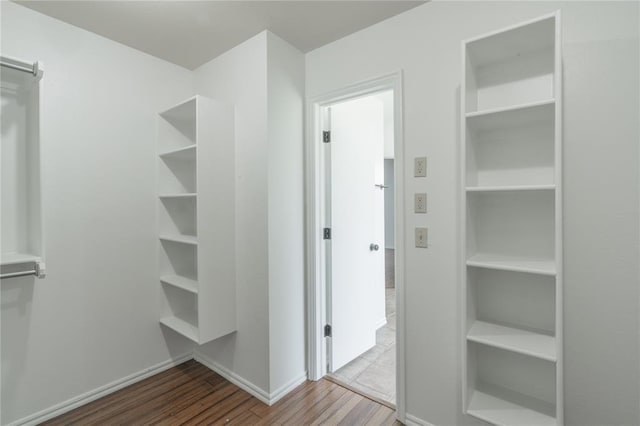 201 NW 160th Ter, Edmond, OK 73013 - walk in closet featuring wood finished floors