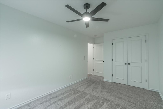201 NW 160th Ter, Edmond, OK 73013 - unfurnished bedroom featuring carpet, a closet, and ceiling fan