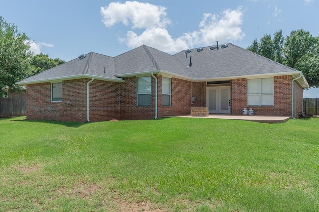 201 NW 160th Ter, Edmond, OK 73013 - rear view of house featuring a patio, a shingled roof, brick siding, and french doors
