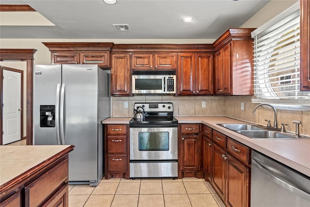 4705 Stag Horn Dr, Yukon, OK 73099 - kitchen with appliances with stainless steel finishes, light countertops, backsplash, and recessed lighting