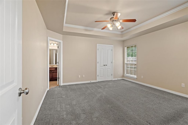 4705 Stag Horn Dr, Yukon, OK 73099 - unfurnished bedroom with ornamental molding, carpet, a raised ceiling, a ceiling fan, and ensuite bath