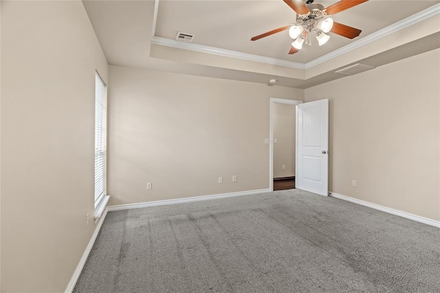 4705 Stag Horn Dr, Yukon, OK 73099 - carpeted empty room featuring a tray ceiling, ceiling fan, and crown molding