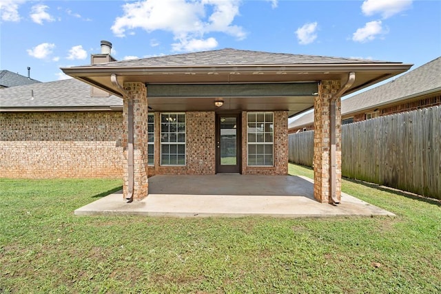 4705 Stag Horn Dr, Yukon, OK 73099 - back of house featuring a patio, a shingled roof, and brick siding