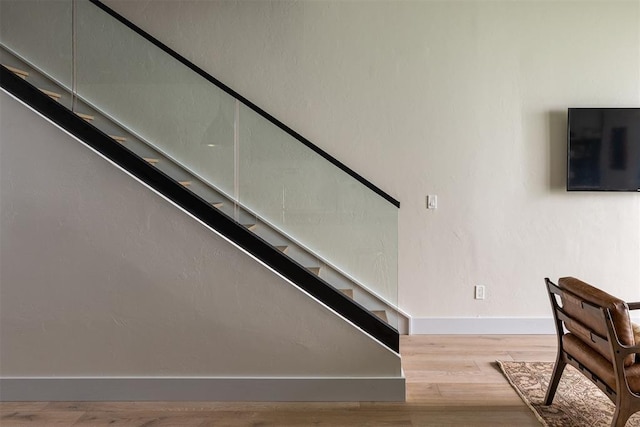 907 NW 9th St Unit B, Oklahoma City, OK 73106 - stairway featuring wood finished floors and baseboards