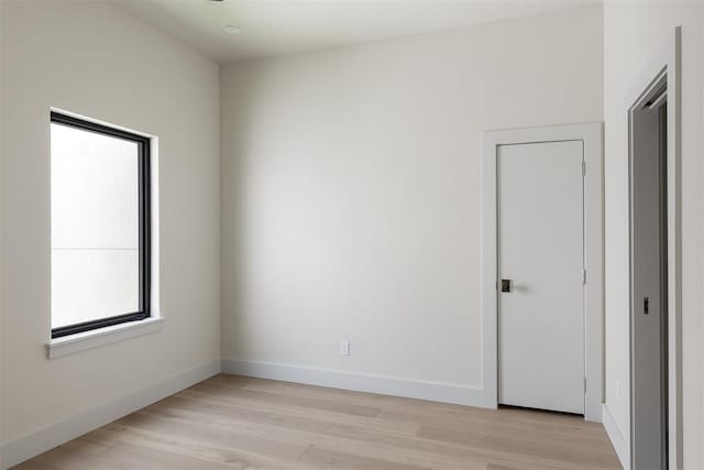 907 NW 9th St Unit B, Oklahoma City, OK 73106 - empty room with light wood-style flooring and baseboards