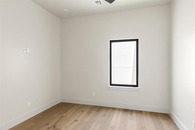 907 NW 9th St Unit B, Oklahoma City, OK 73106 - empty room featuring baseboards and light wood-type flooring