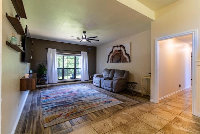 10517 SE 49th St, Oklahoma City, OK 73150 - living room with a ceiling fan and baseboards