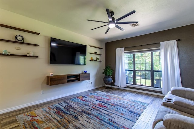 10517 SE 49th St, Oklahoma City, OK 73150 - living area with wood finished floors and a ceiling fan
