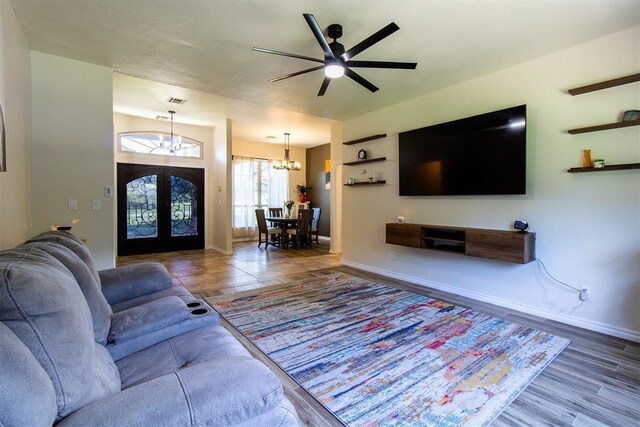 10517 SE 49th St, Oklahoma City, OK 73150 - living room featuring french doors, a chandelier, and a ceiling fan