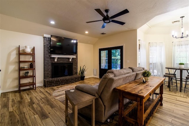 10517 SE 49th St, Oklahoma City, OK 73150 - living room with vaulted ceiling, hardwood / wood-style floors, healthy amount of natural light, and a chandelier