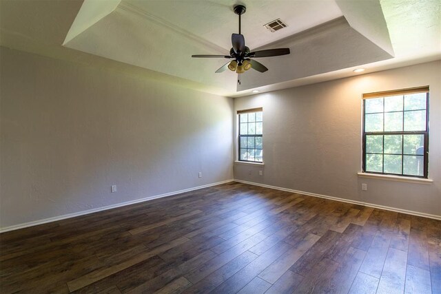 10517 SE 49th St, Oklahoma City, OK 73150 - spare room featuring a raised ceiling, dark wood-style floors, a ceiling fan, and recessed lighting