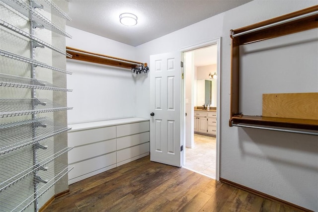 10517 SE 49th St, Oklahoma City, OK 73150 - spacious closet featuring hardwood / wood-style floors and a sink