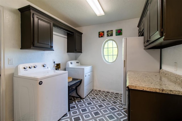 10517 SE 49th St, Oklahoma City, OK 73150 - washroom featuring cabinet space, washing machine and clothes dryer, and light floors