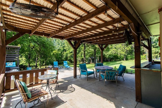 10517 SE 49th St, Oklahoma City, OK 73150 - view of patio / terrace with outdoor dining space and view of wooded area