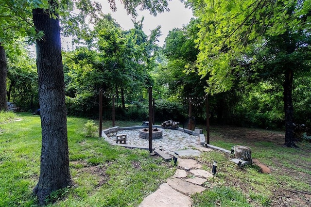 10517 SE 49th St, Oklahoma City, OK 73150 - view of green lawn featuring a fire pit and a patio