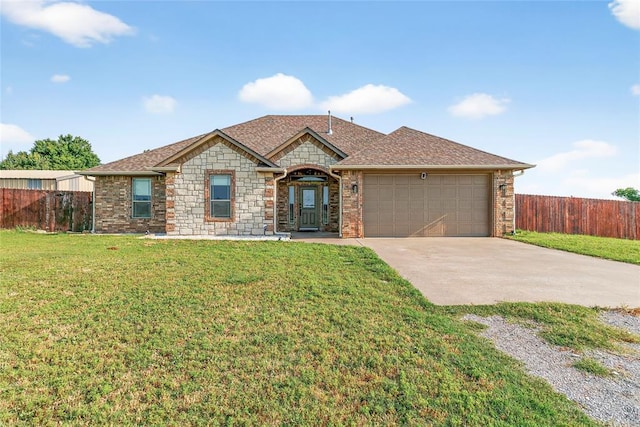 5901 NE Watts Rd, Elgin, OK 73538 - view of front of house featuring concrete driveway, a garage, a shingled roof, and stone siding