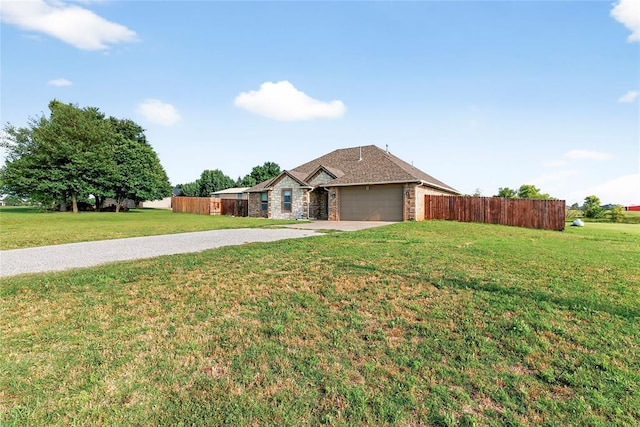 5901 NE Watts Rd, Elgin, OK 73538 - single story home with concrete driveway, stone siding, and a garage